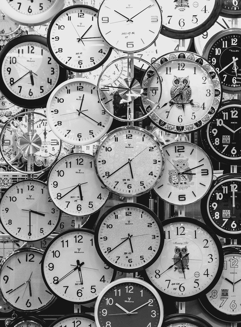 Black and White wall of clocks